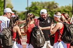 An IU Southeast women's tennis player returns a ball.